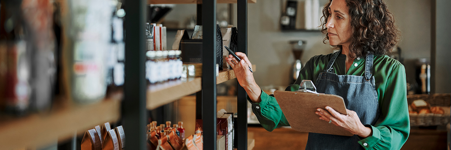 A woman business owner does an inventory of products